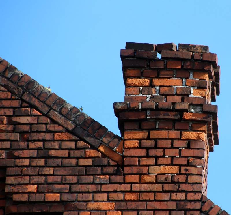 Damaged chimney on an Peabody home showing cracks and missing mortar